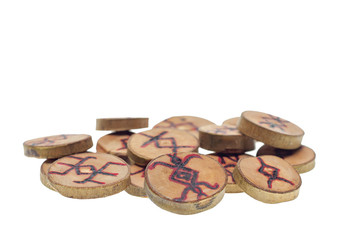 Old wooden runes isolated on a white background