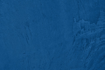 Elegant classic blue colored concrete textured background with roughness and irregularities to your design or product. 2020 color of the year trend concept.