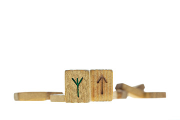 Old wooden runes isolated on a white background