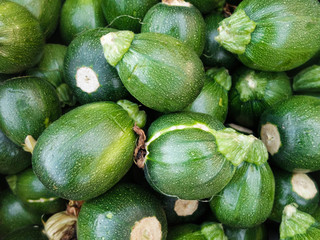 Tiny squashes on the market. Green zucchini