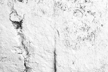 Texture of a concrete wall with cracks and scratches which can be used as a background