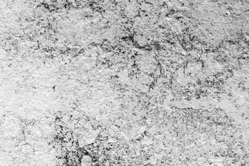 Texture of a concrete wall with cracks and scratches which can be used as a background