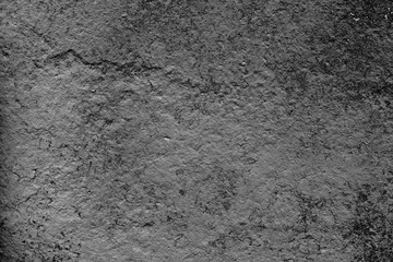 Texture of a concrete wall with cracks and scratches which can be used as a background