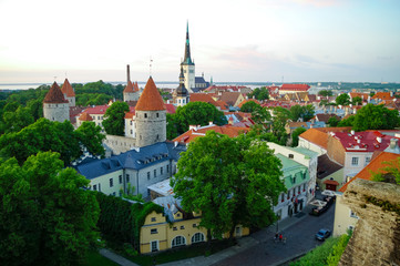 Obraz premium Aerial cityscape with Medieval Old Town, St. Olaf Baptist Church and Tallinn City Wall, Tallinn, Estonia