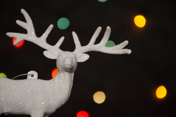 christmas deer decoration on garland background	