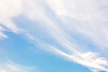 Blue sky and soft white clouds at day time for background.