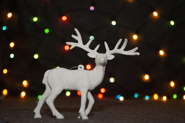 christmas deer decoration on garland background	
