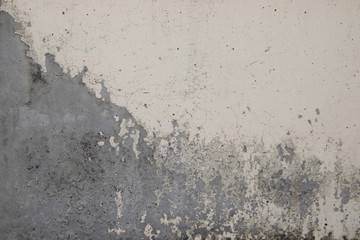 Peeling paint on a concrete wall, Pattern of rustic white grunge material, Cracks, scrapes,peeling old paint and plaster on background of old cement wall