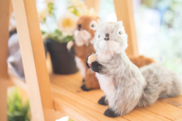 Cute squirrel doll on the table for decoration.