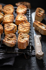 Fresh toasted wholegrain bread on a cooling sheet