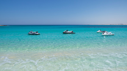 Marsa Matruh, Egypt. Jet skis ready to be used by tourists. Fabulous holidays. Mediterranean Sea, north Africa. Amazing sea with tropical blue, turquoise and green colors