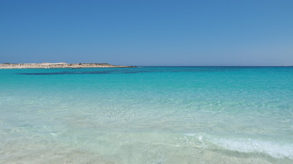 Fototapeta na wymiar Marsa Matruh, Egypt. The amazing sea with tropical blue, turquoise and green colors. Relaxing context. Fabulous holidays. Mediterranean Sea. North Africa. Clean and pristine sea