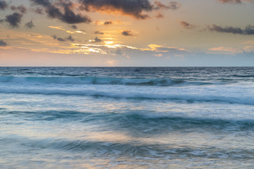 Fototapeta na wymiar Clouds, sea and surf sunrise seasape