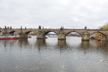 Fototapeta premium Cityscape of the Czech capital Prague and the Vltava river. View of Charles Bridge and Prague Castle on Christmas Eve.