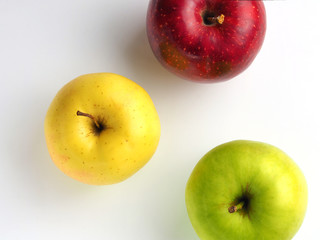 Red, green and yellow apple on a white background