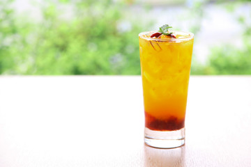 Fresh orange juice soda with strawberry syrup