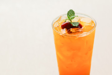 Fresh orange juice soda with strawberry syrup