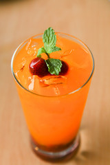 Fresh orange juice soda with strawberry syrup