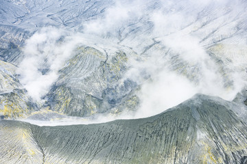 (Selective focus) Close-up view of the Tangkuban Perahu volcano with clouds of gases raising from...