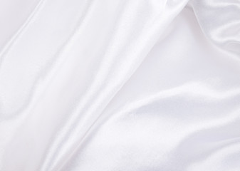 Extreme macro shot of folded white silk (as an abstract curved background or silk texture), shallow...