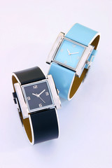 trendy wrist watches black and blue for women on white background