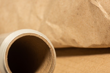 Roll of packaging film with paper in a cardboard box