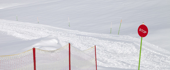 Closed ski slope with stop sign