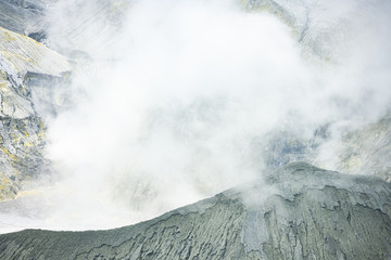 (Selective focus) Close-up view of the Tangkuban Perahu volcano with clouds of gases raising from...