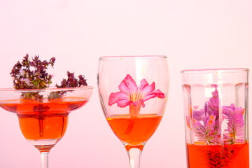 glasses of cocktails and flowers