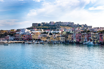 Fototapeta na wymiar Procida, Naples, Campania, Italy: the pastel colors of the Marina Corricella in the port of Procida, one of the Phlegraean Islands off the coast of Naples in southern Italy.