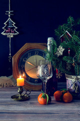 The clock, tangerines, christmas cookies and champagne