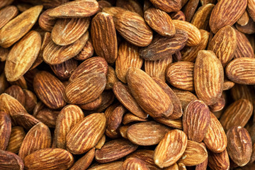 Peeled almonds background. Many almonds close up.