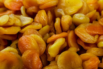 Dried apricot background. Many traditional dried fruits close up, top view.