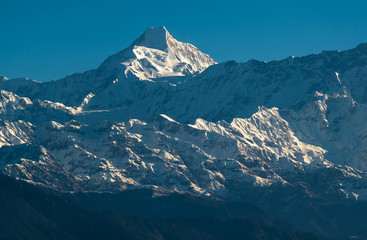 A portrait of the Chaukhamba peak and the glaciers below as seen from the Himalayan village of Chaukori in Uttarakhand, India.
