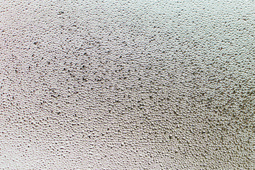 Closeup background and texture be full of winter droplets on glass.