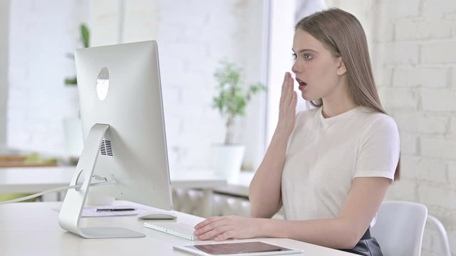 Hardworking Young Woman having Failure on Desktop 