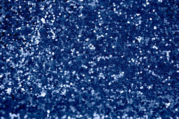 Obraz premium Abstract background with glitter in 2020 classic blue color. Modern sparkly backdrop with beautiful bokeh and copyspace.