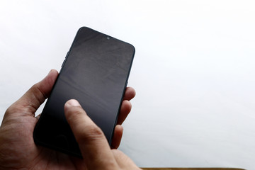 Human hand holding smartphone