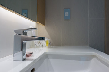 modern faucet on white countertop