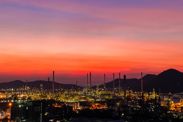Fototapeta na wymiar The colorful lights in oil refinery industry power station at night time with Twilight sky ,Chonburi,Thailand.