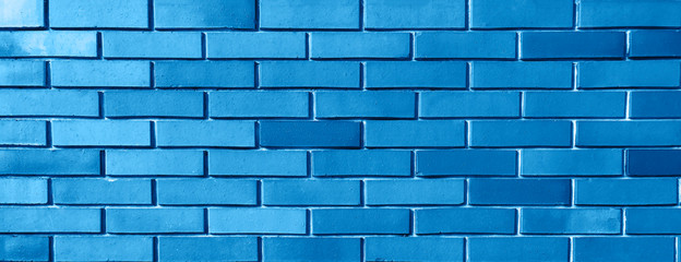 Blue background from brick wall texture pattern, wallpaper design template.