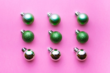 Xmas pattern. Christmas balls for decorations isolated on pink background. Flat lay. Abstract winter concept.