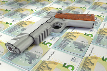 gun placed on euro bank note
