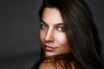 Portrait of pretty woman dark hair, blue eyes. - obrazy, fototapety, plakaty