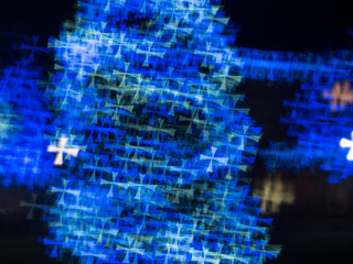Fototapeta na wymiar Defocused cross shape blue and white Christmas Background texture stock photo