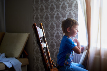 boy looking out the window