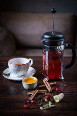 cranberry tea with spices, honey and ginger