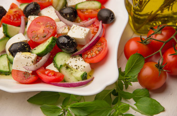 greek salad with tomato, olive and feta