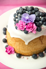 cake with icing berries and flowers