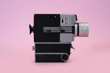 Old Film Camera on Pink Background